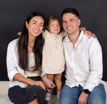Happy family posing together in a warm and joyful photoshoot at Pixel Craft Digital Studio.