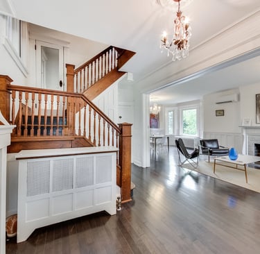 a staircase way with a chandelier and a chandelier