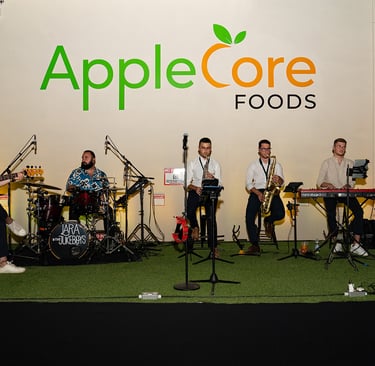 a band of musicians performing at an applecore foods event