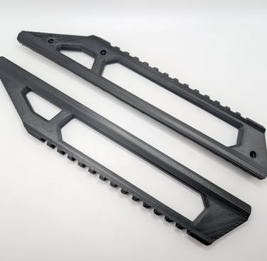 a pair of black plastic pegs on a white background