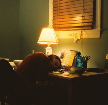 Disengaged employee asleep at their desk representing job hugging 