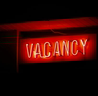 a neon sign that says vacancy