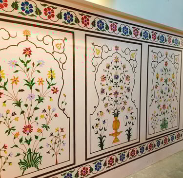 a wall with a wall art painting of flowers