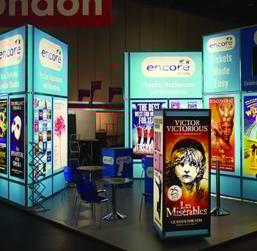 Exhibition stand with a large backlit display of various movie posters