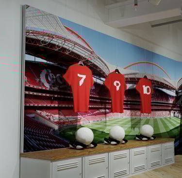 Large tension fabric wall graphic installation with counters below.