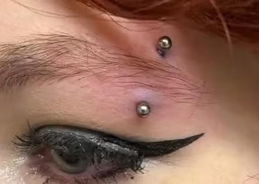 Eyebrow piercing the plain curved barbell