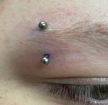 Titanium curved barbell for eyebrow piercing in Stonehaven