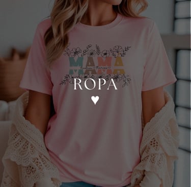 a woman wearing a pink shirt and jeans with a heart shaped mama shirt