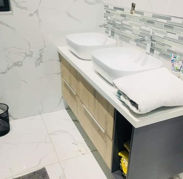 a bathroom with two sinks and a toilet
