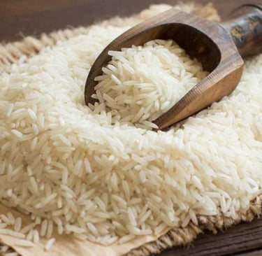 loose basmati rice grains with a rustic wooden  scoop