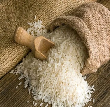 white basmati rice grains spilling from a burlap sack