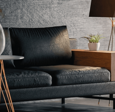 Virtually staged modern living room with black leather sofa, side table, and soft lighting
