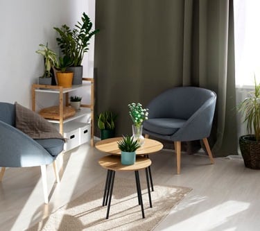 a living room with a chair and a table