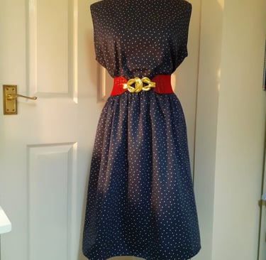 Black dress complete with red belt