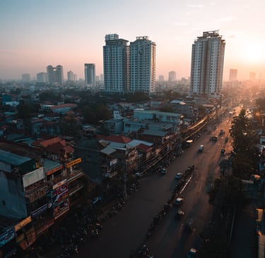 Wide view of the Phnom Penh skyline showing new high rise apartment buildings and busy urban streets