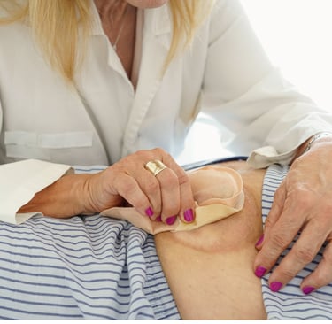 Nurse helping patient with stoma bag to prevent leakage