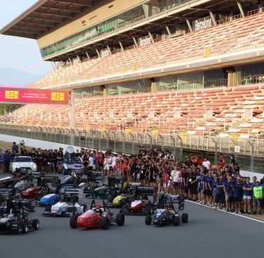 a group of motorcyclists on a race track