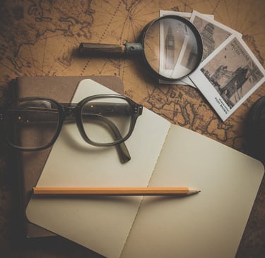 a pair of glasses and a pencil and a pencil on a map