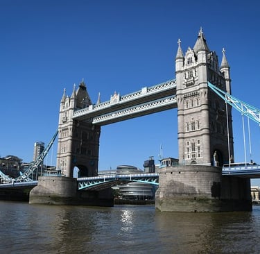 a bridge spanning the river with a bridge in the background corporasti