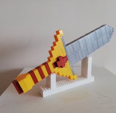 a lego - style plane with a yellow and red wing Corporasti regalos empresariales