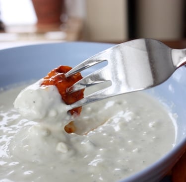 buffalo chicken bite dipped in blue cheese dressing