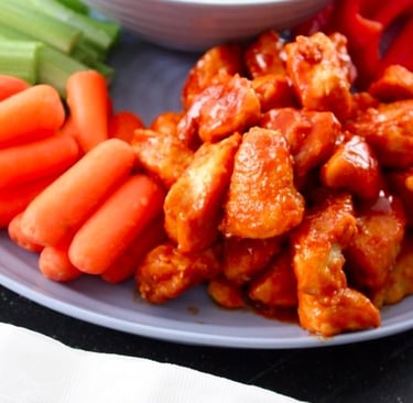buffalo chicken bites with blue cheese dip and vegetables