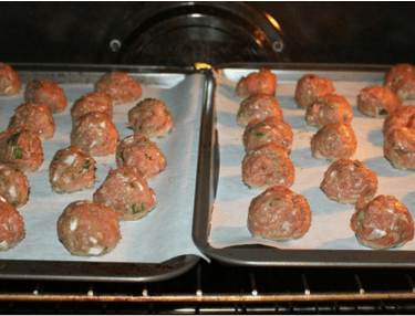 uncooked green curry turkeyballs in oven