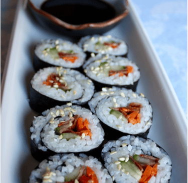 kim bap, rolled rice in nori with vegetables and bacon