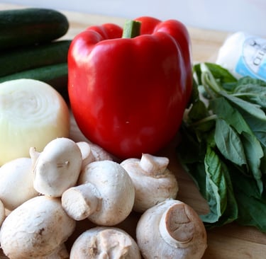 uncooked ingredients for summer veggie pizza