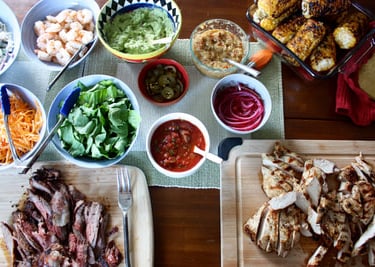 taco feast, beef, chicken and shrimp with many toppings