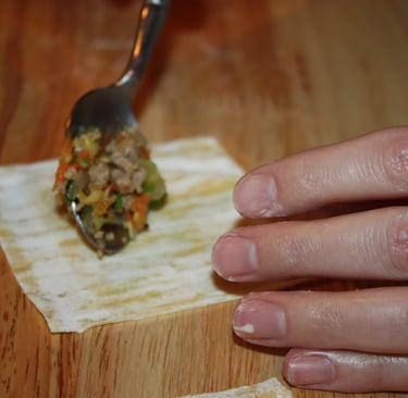 placing filling on wonton wrapper