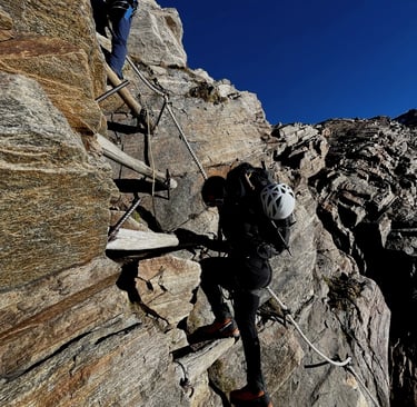 mais alhajri climbing a rocket mountain using a via ferrata route