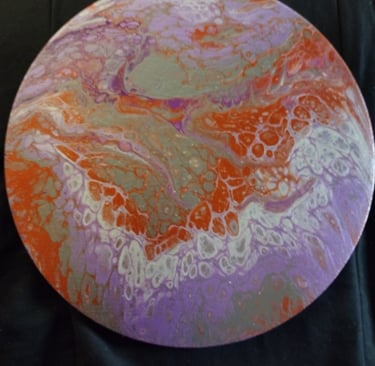 a colorful painted plate with a circular design