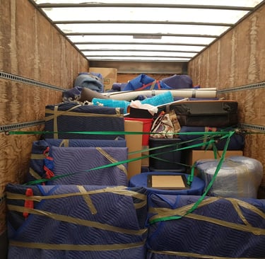 a canada's most wanted movers moving truck partially full with safely packed items.