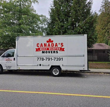 Canada’s Most Wanted Movers truck parked on a residential street in White Rock during a local move.