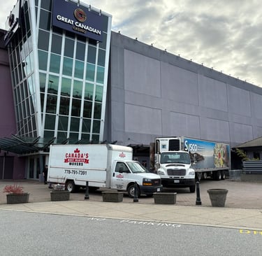 Canada’s Most Wanted Movers trucks parked at Great Canadian Casino Vancouver for a commercial moving job.