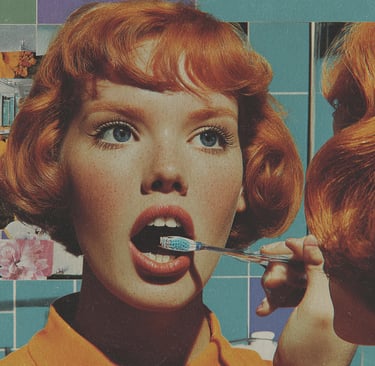 Woman brushing her teeth while looking at herself in the mirror.