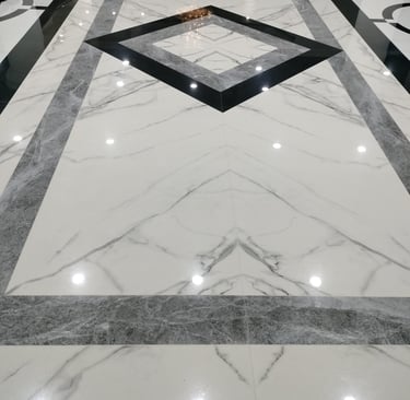 a marble floor with a black and white marble floor