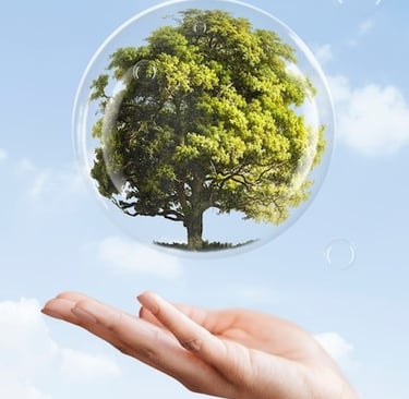 a person holding a bubble bubble bubble in front of a blue sky