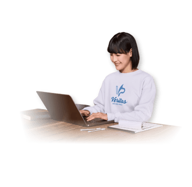 a woman sitting at a desk with a laptop