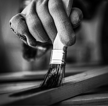 a person's hand holding a brush and a brush