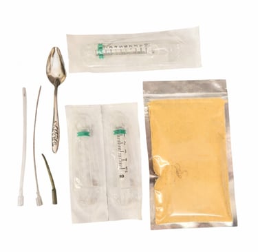 baby bird feeding formula in foil pouch with syringes and crop tubes and spoon