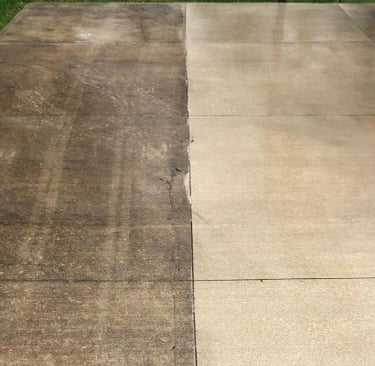an image showing half of a driveway pressure washed, while showing the other half still dirty