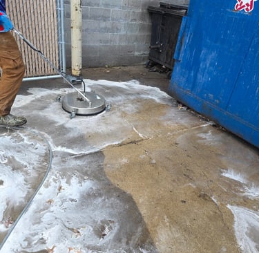 dumpster enclosure in the process of getting cleaned