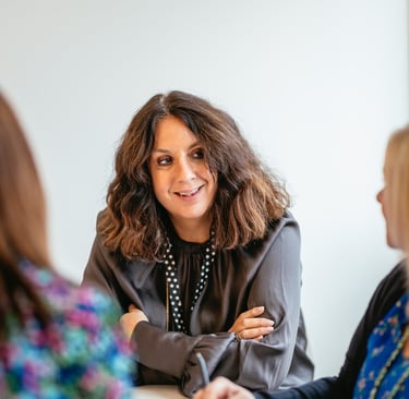 a woman in a gray jacket and a woman in a black jacket