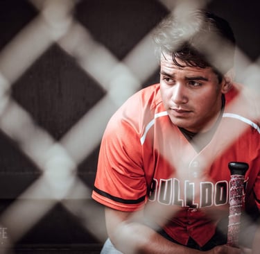 a baseball player is sitting in the dugout