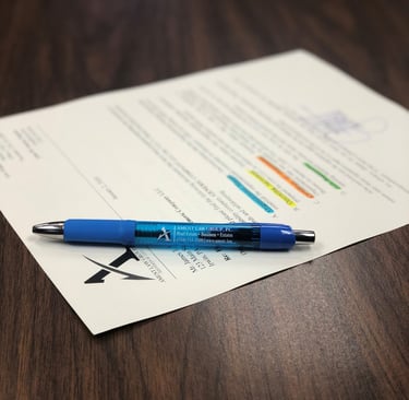 a pen with paper on a table