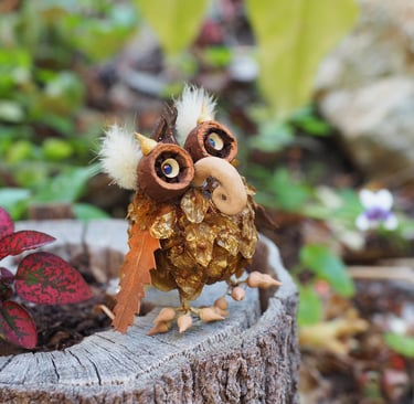 owl critter made from seeds, shells and leaves