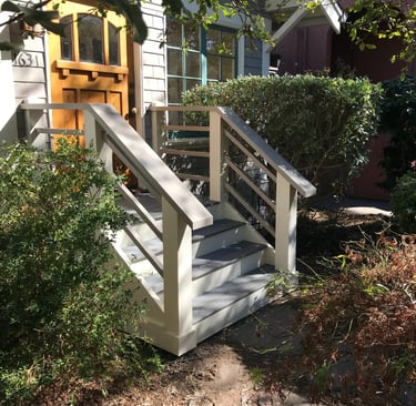 a house with a wooden deck and stairs
