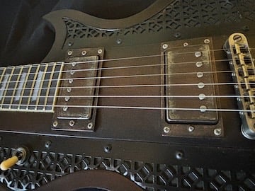 Ironbrand Les Paul style dark industrial guitar. Top angled view.